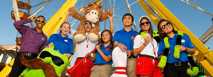 Employees at Six Flags in front of a ride