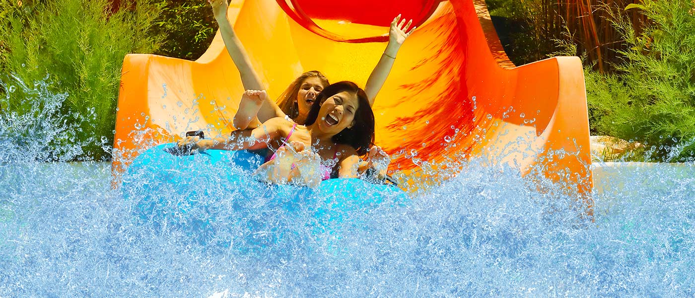 People sliding down a ride at waterpark